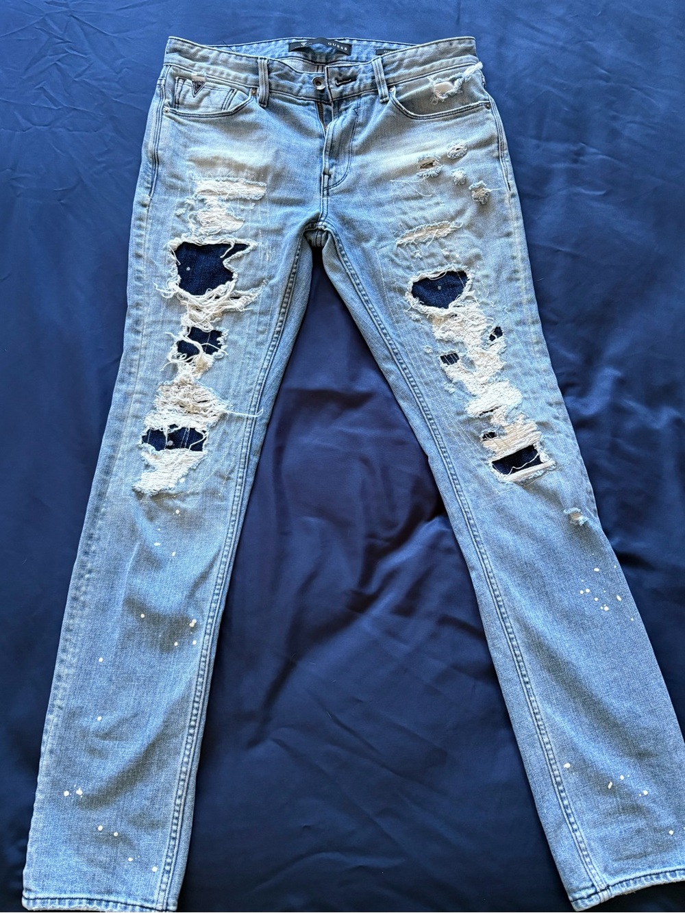 Guess Men's Light Blue Distressed Skinny Jeans with Dark Patch Accents